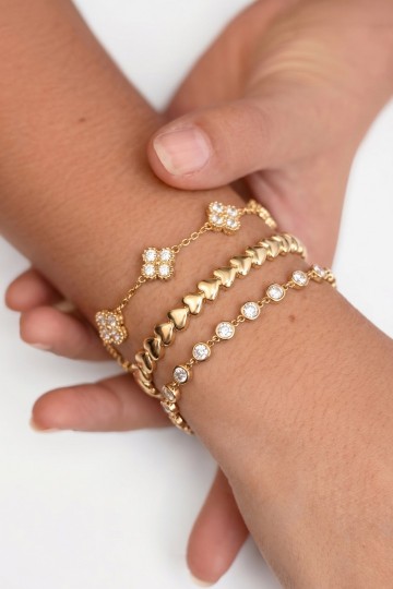Armband goudkleurig met stralende steentjes